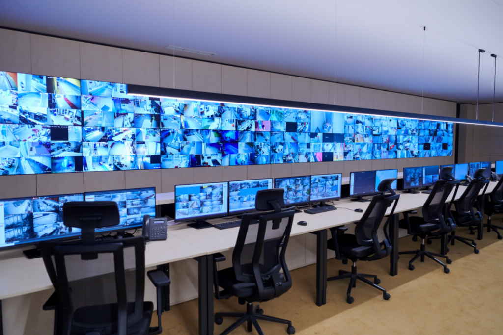 A professional security control room with multiple surveillance monitors supporting intelligent security operations for Proactive Specialised Security Solutions.