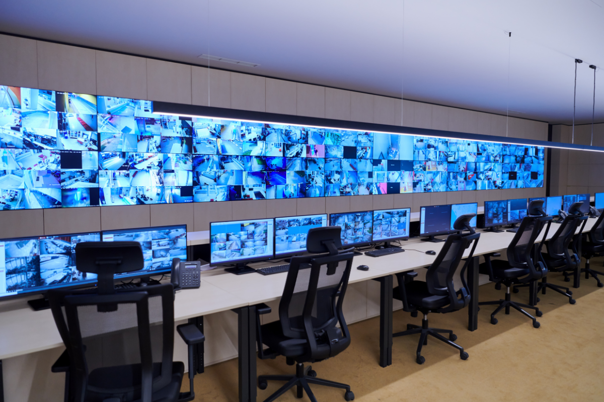 A professional security control room with multiple surveillance monitors supporting intelligent security operations for Proactive Specialised Security Solutions.