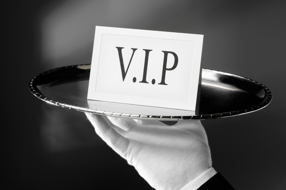 VIP access card presented on a silver tray symbolising premium security services.